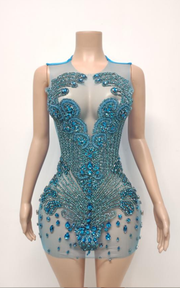 Sheer mini birthday dress with crystal beading and see-through mesh for party and nightlife wear.