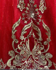 Royal red tulle ball gown with gold embellished bodice and large back bow