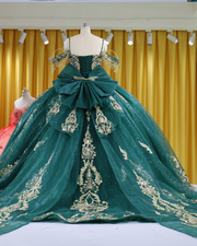 Emerald green and gold ball gown with lace appliqué bodice and beaded fringe sleeves