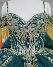 Emerald green and gold ball gown with lace appliqué bodice and beaded fringe sleeves