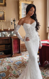 Lace sweetheart mermaid wedding dress with lace appliqués and sweep train for brides.