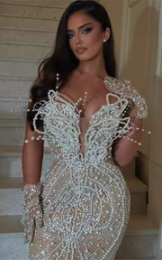 Dark champagne beaded mermaid prom dress with shimmering beadwork and elegant floor-length design.