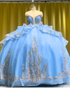 Sky blue quinceañera dress with rose gold appliqués, fitted bodice, and full princess skirt.