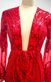 Luxury formal gown featuring illusion sleeves and dramatic train