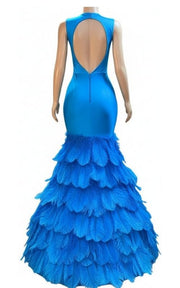 High-end party dress featuring crystal bodice and layered feather skirt