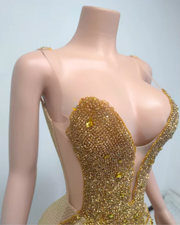 Luxury backless gold crystal mesh see-through long evening dress for women, embellished with sparkling crystals.