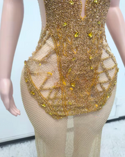 Luxury backless gold crystal mesh see-through long evening dress for women, embellished with sparkling crystals.