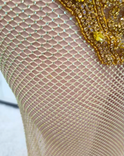 Luxury backless gold crystal mesh see-through long evening dress for women, embellished with sparkling crystals.