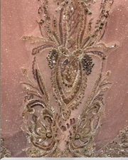 Blush pink quinceañera gown with gold beading, fitted bodice, and full princess skirt.