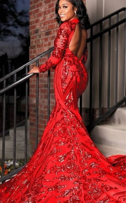 Luxury formal gown featuring illusion sleeves and dramatic train