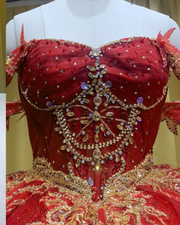 Scarlet red off-shoulder quinceañera dress with sparkling sequins and princess ball gown silhouette.