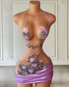 Mannequin Wearing a Light Purple Sheer Neck Floral Birthday Dress with Delicate Embellishments and Floral Accents, Styled for Elegant Celebrations