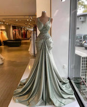 Long Luxury Mermaid Style V-neck Beaded Silver Evening Gowns