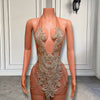 Mannequin dressed in a luxury crystal halter mini dress with hand-embellished rhinestones, perfect for birthday celebrations and special occasions